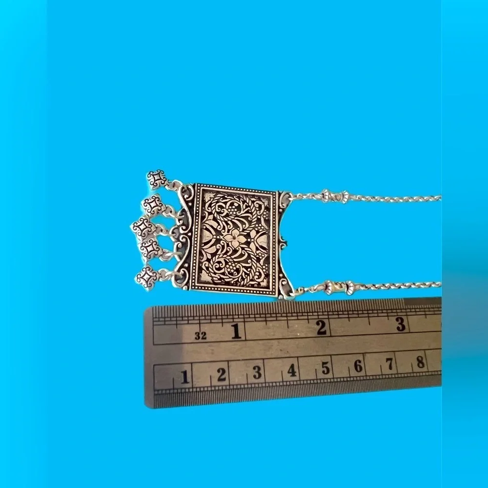Brighton pendant necklace. Square pendant with loose charms. 10